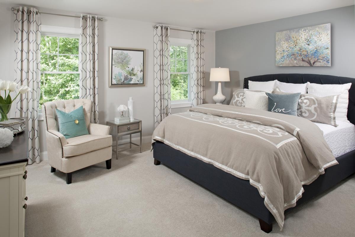 Bedroom with navy upholstered bed