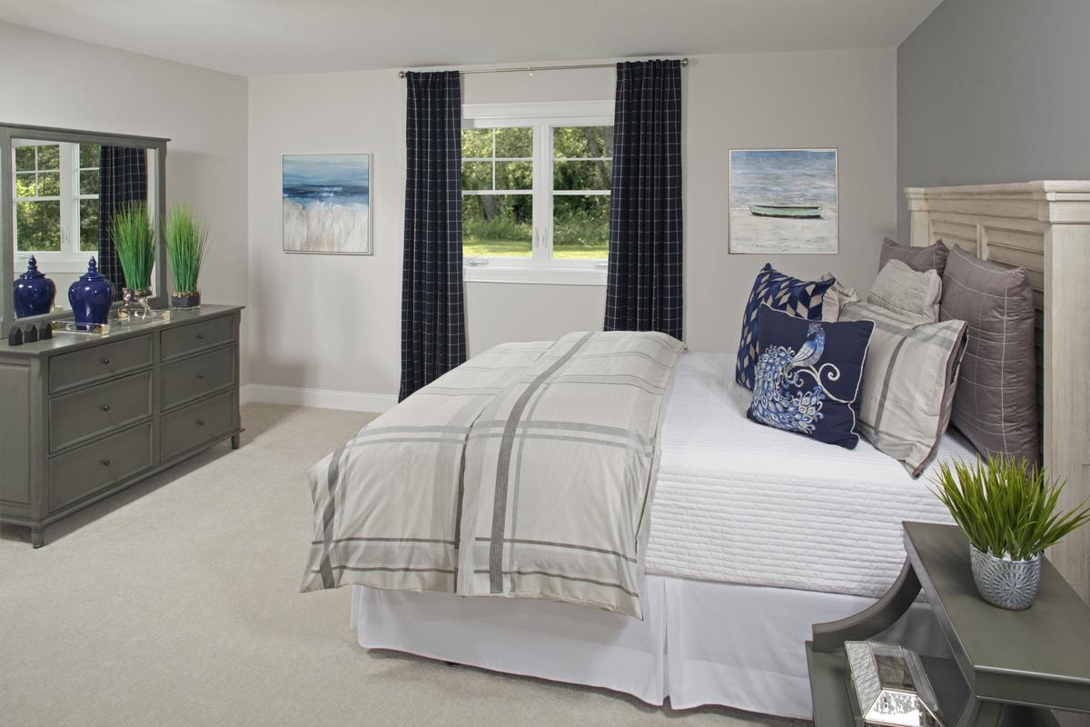 Guest bedroom with coastal art