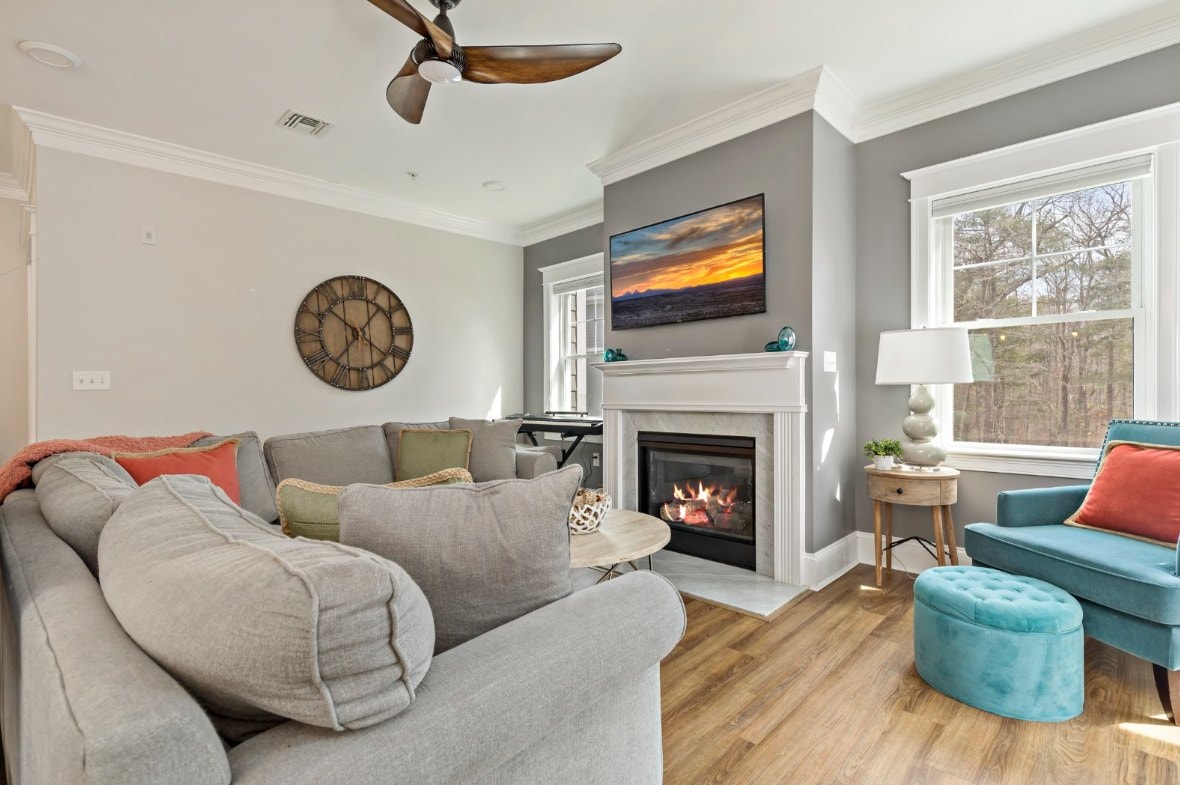 Corner-unit condo living room with gas fireplace